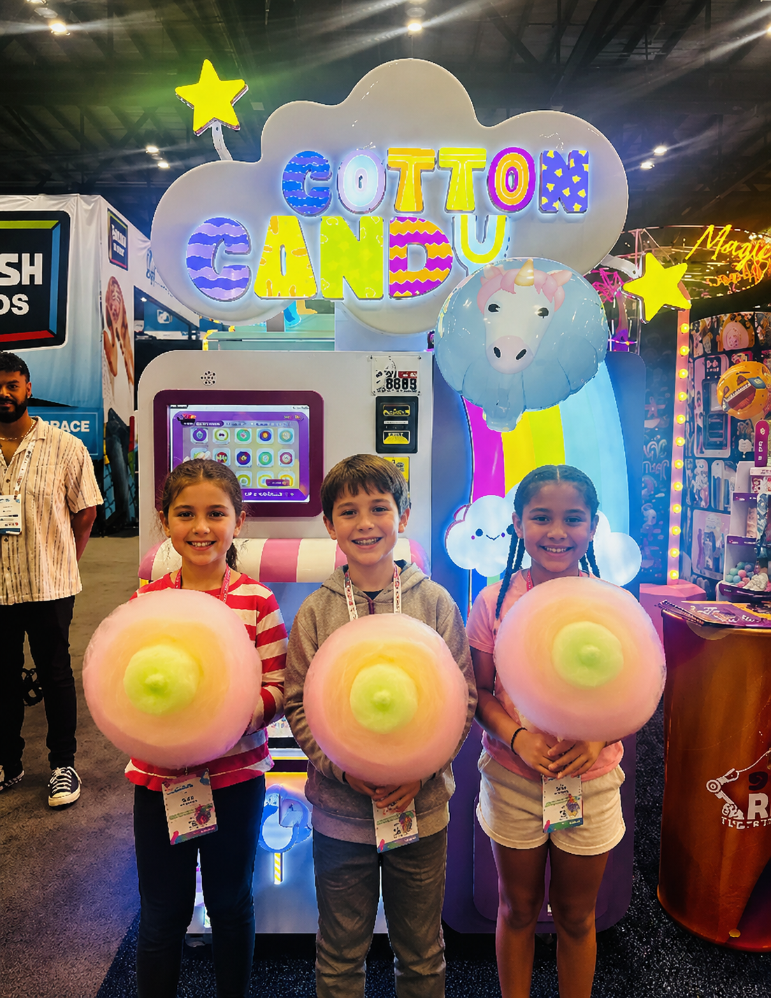 Kids holding cotton candy at an expo